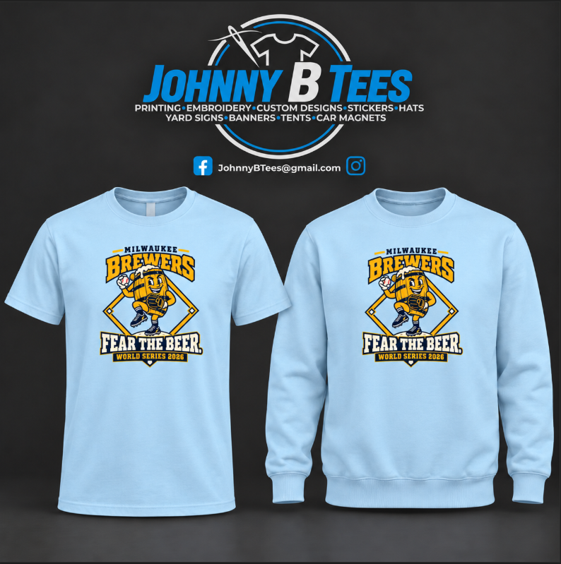 Light blue apparel featuring the Milwaukee Brewers barrel character, baseball diamond, and “Fear the Beer” front graphic with World Series 2026 lettering.